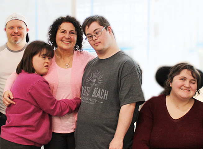 Diverse group members from Abilities Centre smile at the camera
