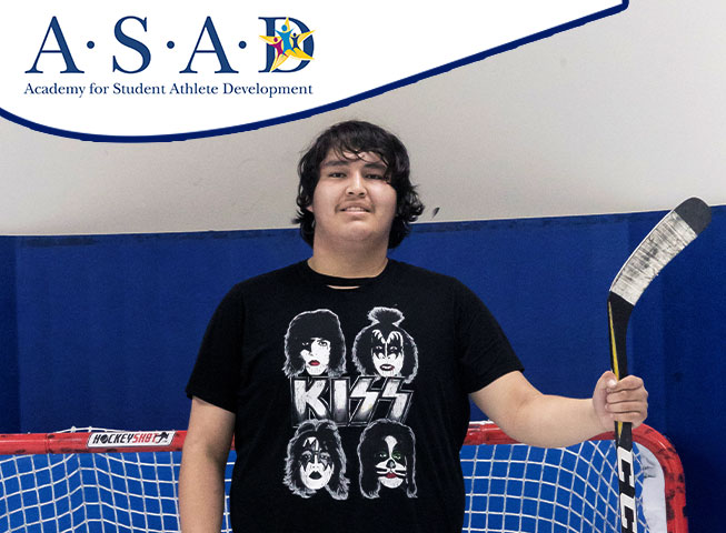 ASAD Student holding a hockey stick