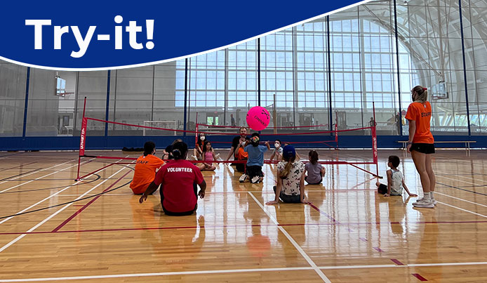 A group of children playing sitting Volley ball at Abilities Centre. Text above reads TRY IT!