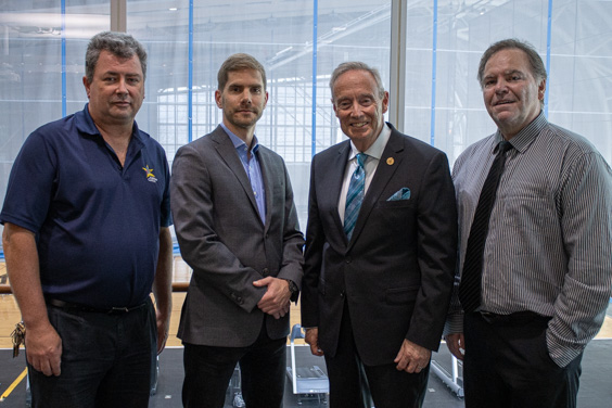 Gordon Burrows, Senior Manager, Facilities, Ross Ste-Croix General Manager and COO of Abilities Centre, Lorne Coe, MPP of Whitby and Thomas Wall, Ontario Trillium Volunteer pose for a photo.