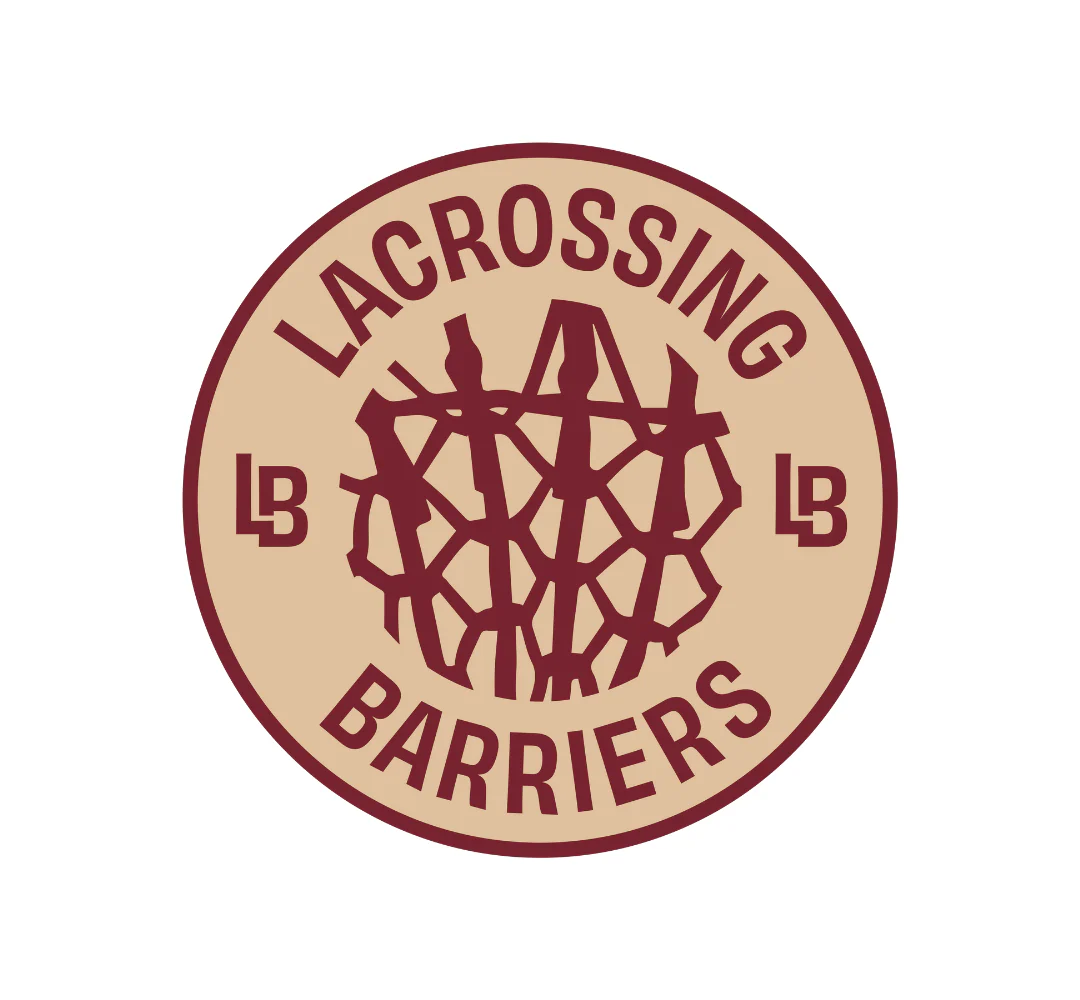 A circular logo with a beige background and maroon design. In the center, an abstract lacrosse net–like pattern is displayed and the words 