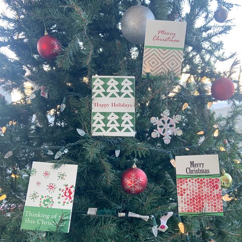 An assortment of Holiday Greeting cards on a Christmas tree