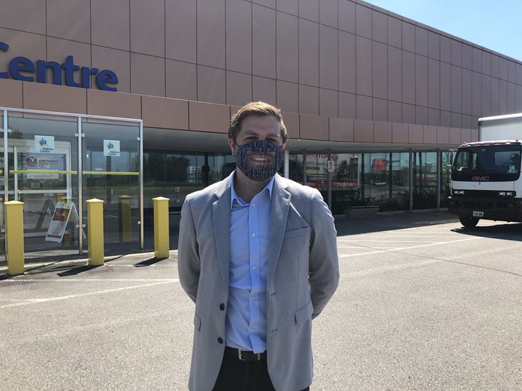 President and CEO Stu McReynolds smiles while wearing a lip reading mask