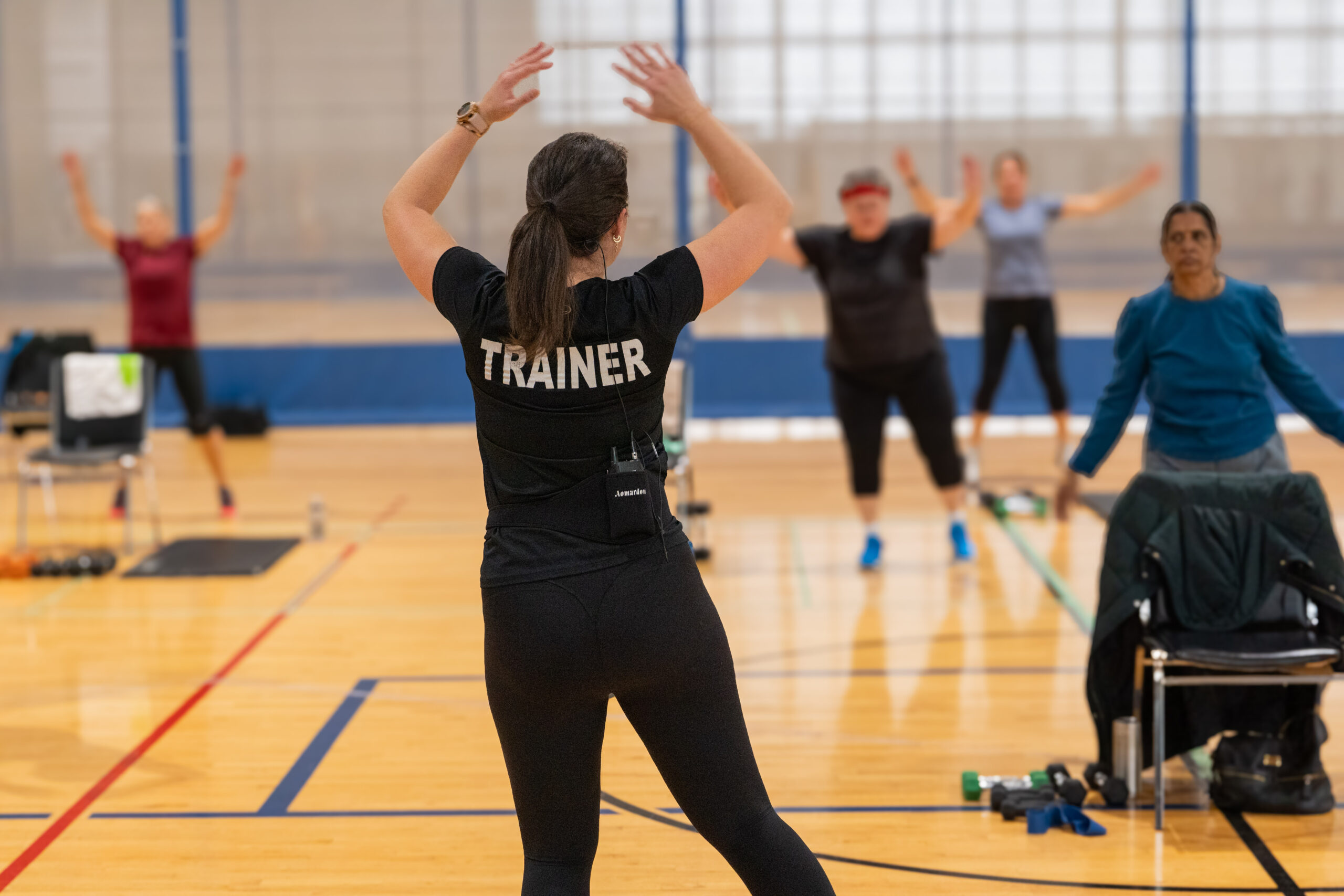 A trainer hosting a group fitness class.