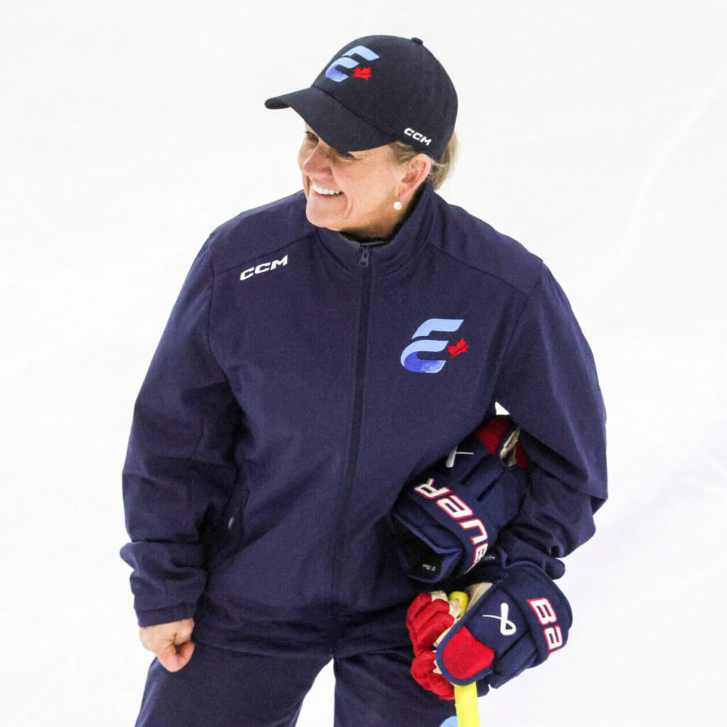 Kathy McLlwain smiles while on the ice.
