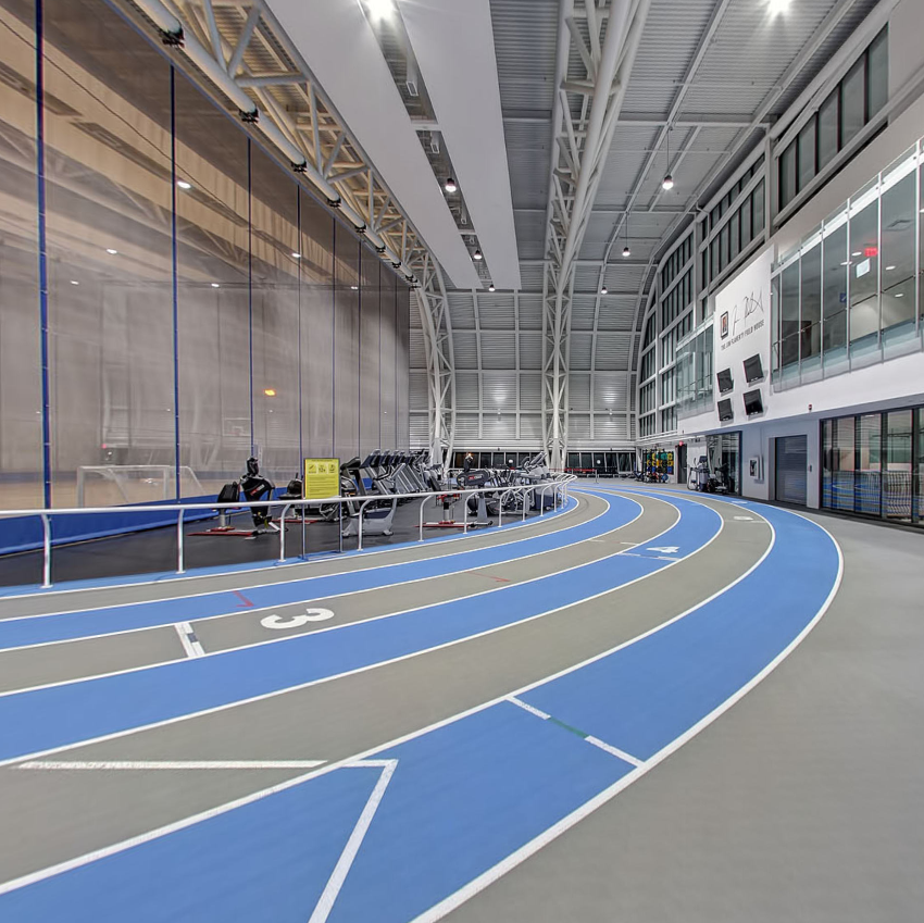 The exercise machine area and track within the field house.