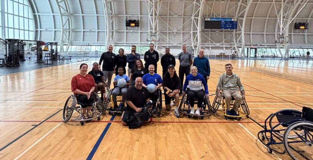 Abilities Centre members and staff pose with the Breakfast Television crews on the court.